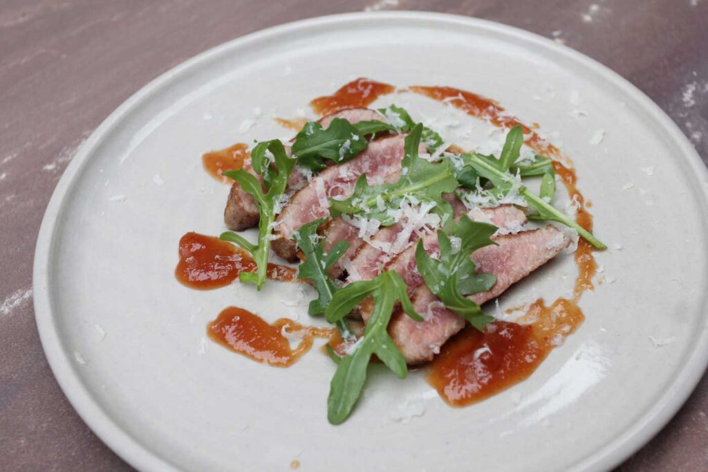 Secreto Iberico with Quince, Rocket and Manchego Cheese